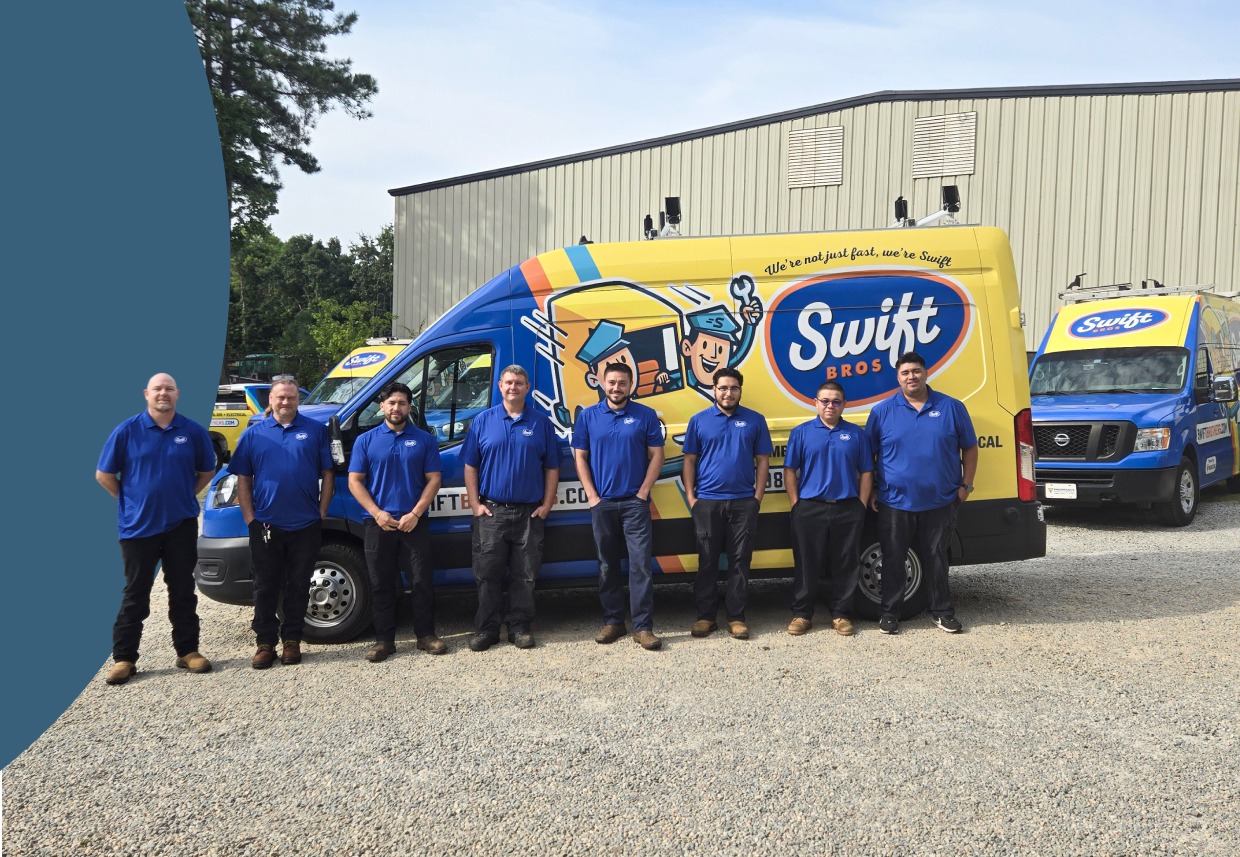 Workers in blue uniforms pose beside a Swift-branded delivery truck and vans.